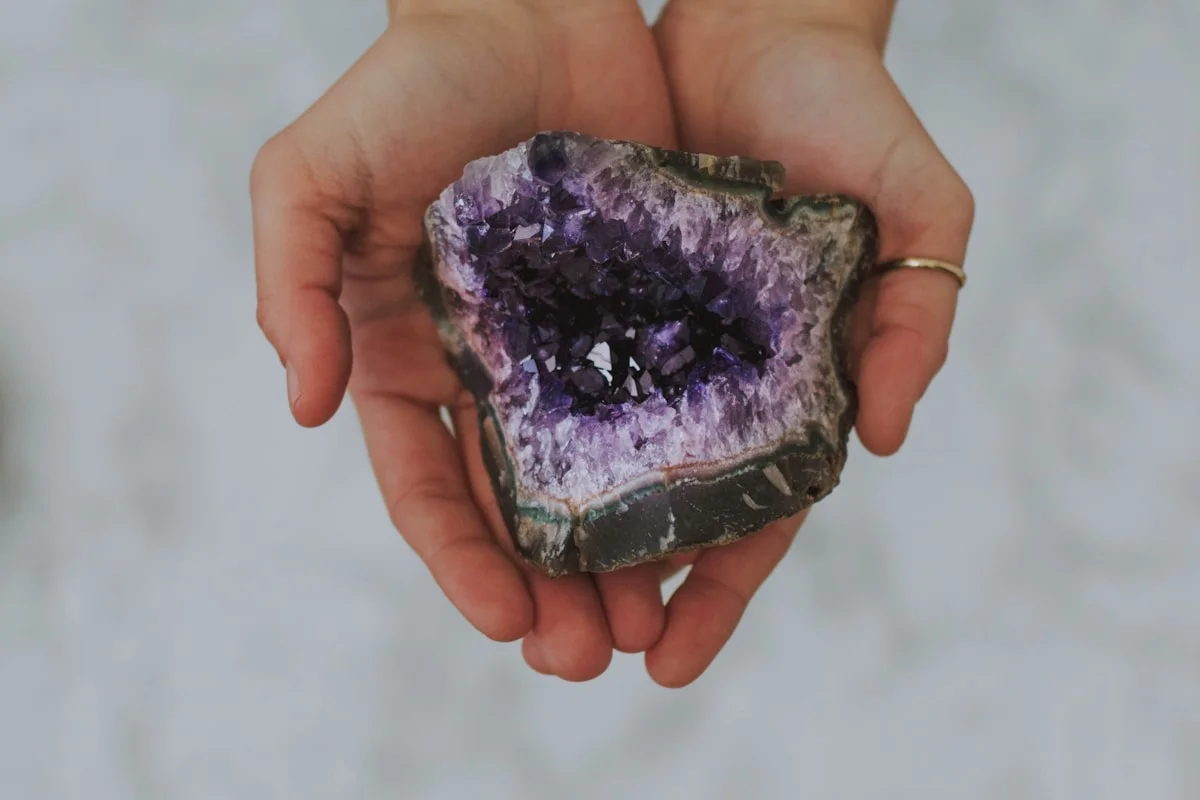 Amethyst geode held in hands